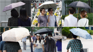 ‘무더위에 양산은 필수’ 